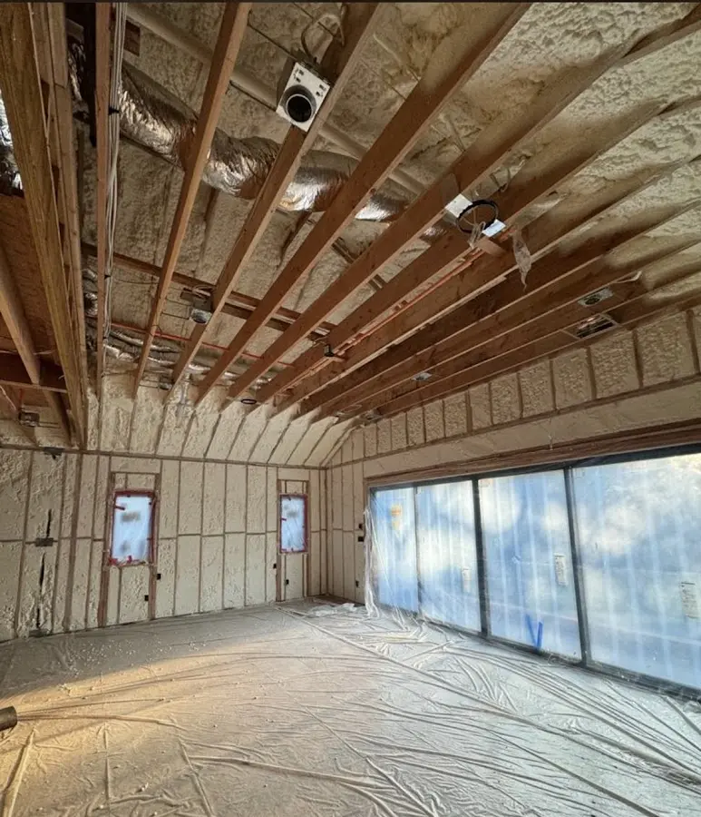 Interior walls and ceiling insulated with spray foam during new construction in Goodyear